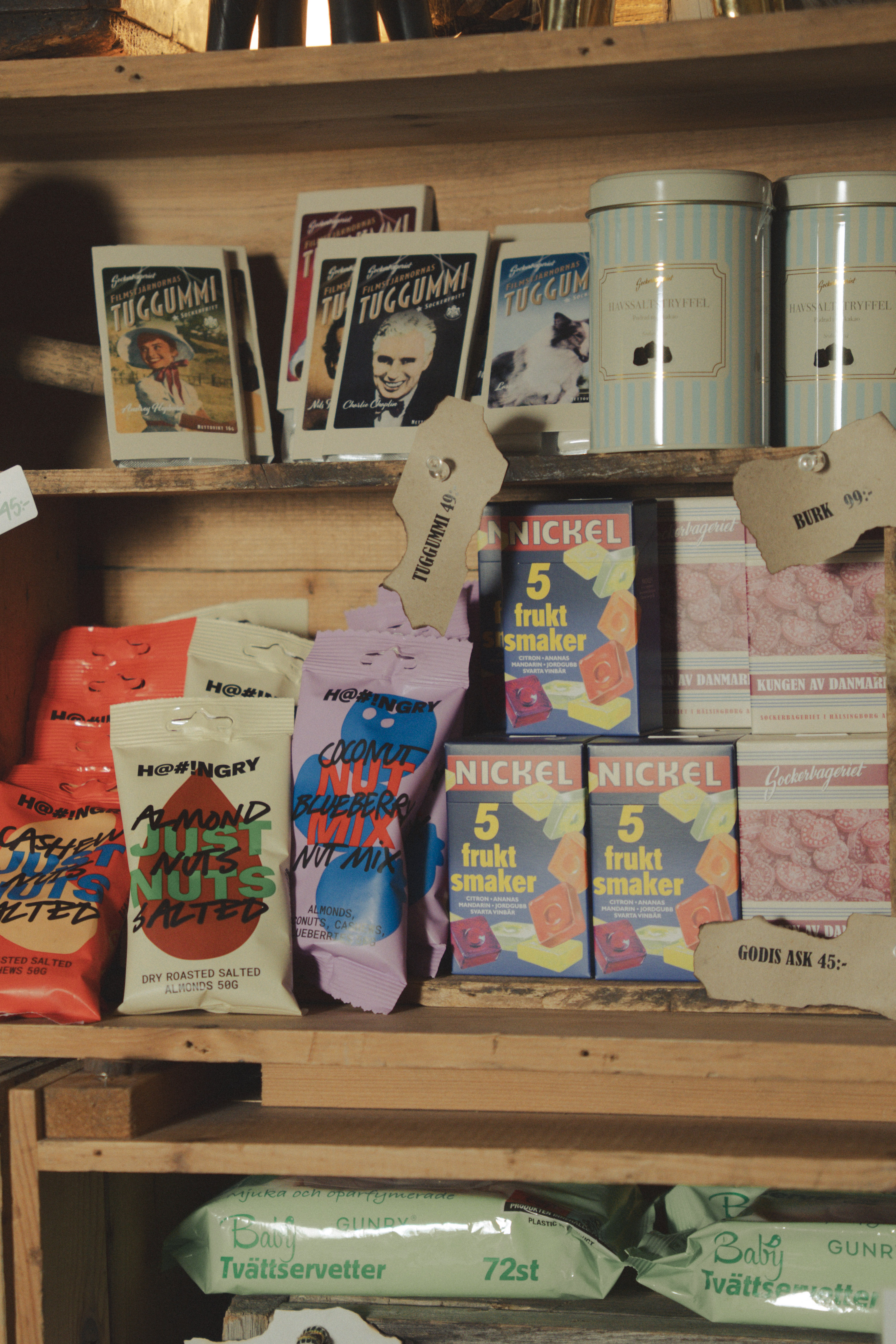 Sweets, nuts and chewing gum on the shelf at reception at Hotell Kungshaga