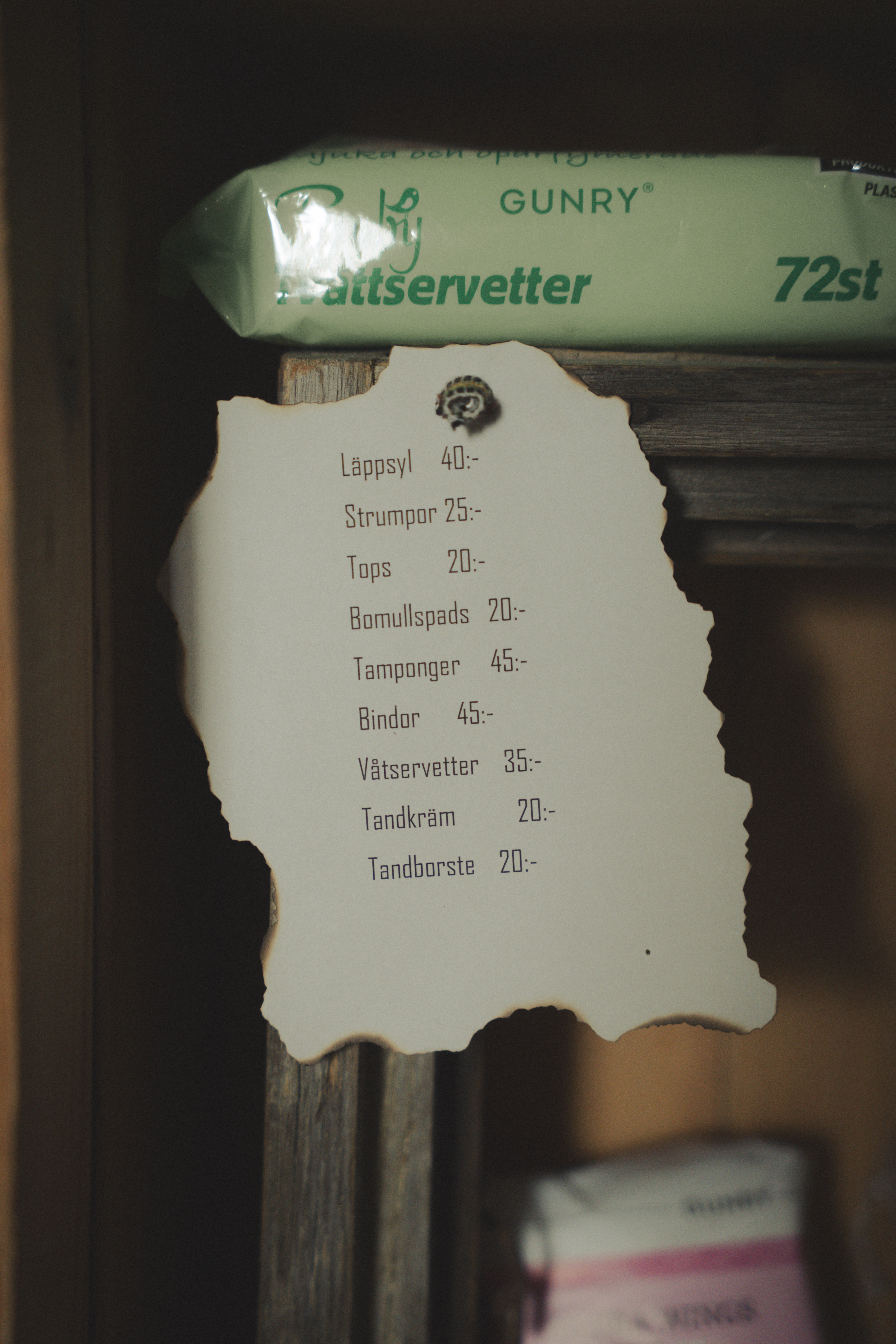 Price list for toiletries at reception at Hotell Kungshaga